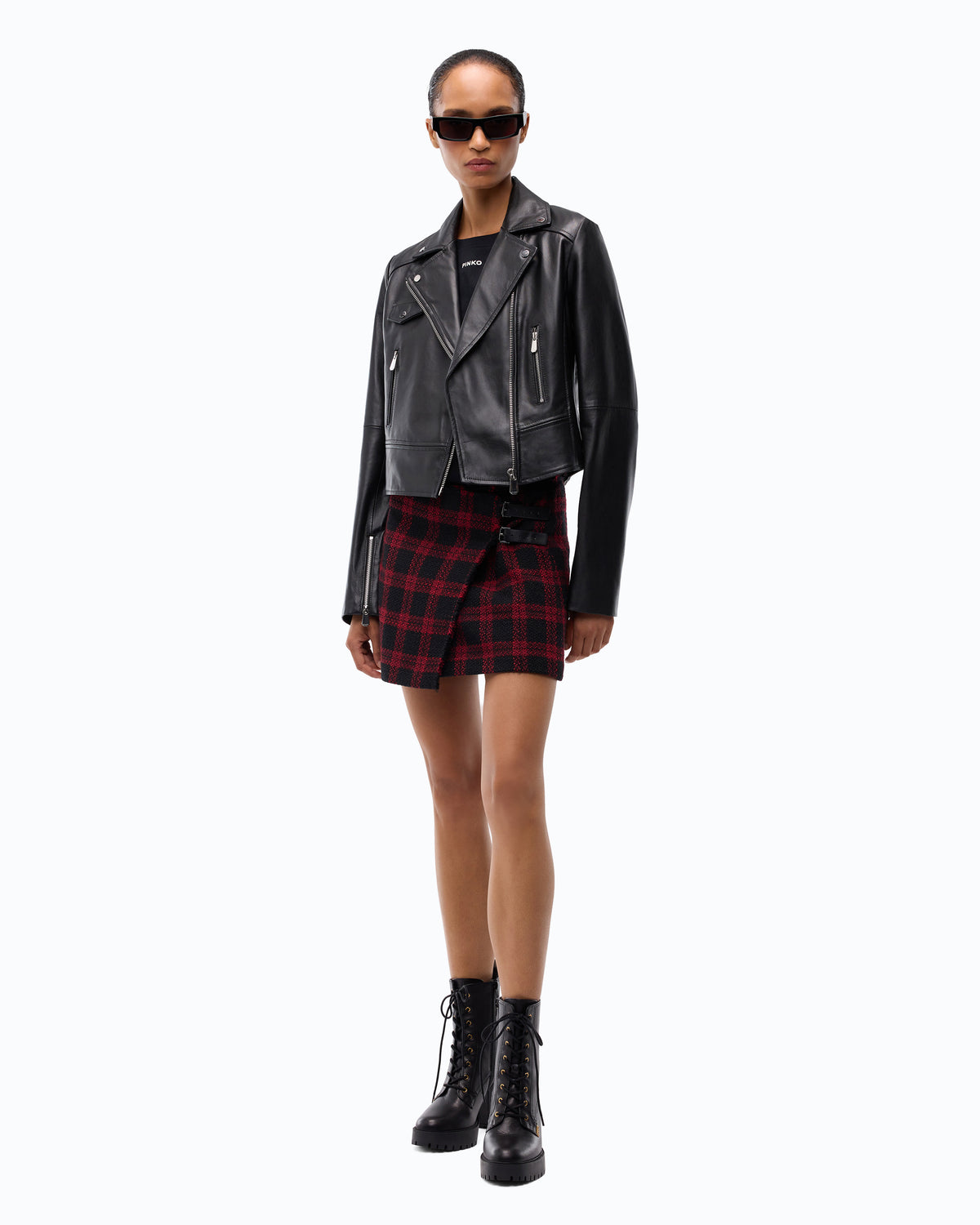 Pinko official image showing a black leather biker-style jacket with zip details
